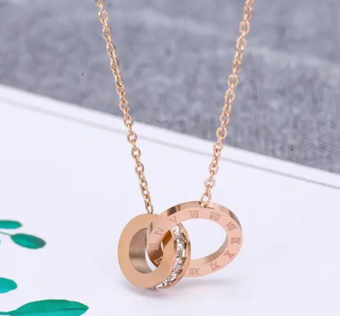 Roman Interlocking Numeral Rose Gold Necklace